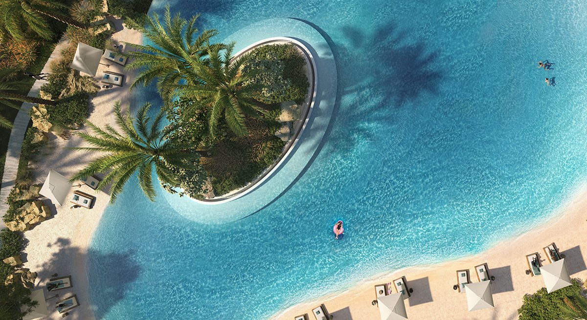 an aerial view of a resort pool and beach